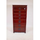 A Chinese hardwood chest with seven drawers, moulded panel sides and back, raised on shaped