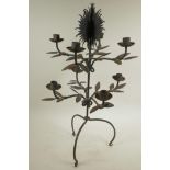 A wrought iron eight branch table top candle holder, 24" high