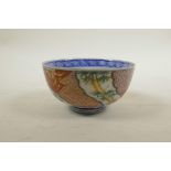 A Japanese Imari porcelain rice bowl with bamboo and cypress tree decoration, six character mark