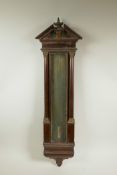 A C19th mahogany and brass thermometer case in the Regency style, 30" high