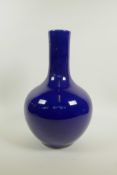 A Chinese powder blue glazed porcelain bottle vase, 6 character mark to base, 13½" high