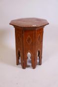 A Moorish style inlaid solid burr yew wood occasional table with folding base and octagonal top, 19"