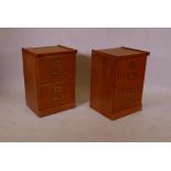 A pair of contemporary two drawer oak filing cabinets with brass handles, 19" x 17" x 28"