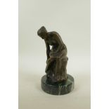 A bronze figure of a female nude, seated, after Luis Noeé, 9" high
