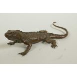 A Japanese Jizai style bronzed metal lizard, indistinct impressed marks to belly, 6½" long