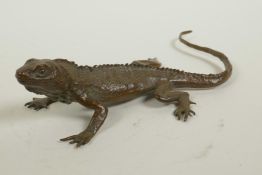 A Japanese Jizai style bronzed metal lizard, indistinct impressed marks to belly, 6½" long