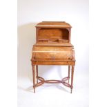 A C19th inlaid satinwood cylinder top bonheur du jour, with a fitted interior and pull out writing