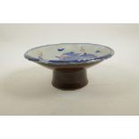 A Chinese blue and white porcelain stem bowl decorated with a dragon chasing the flaming pearl,