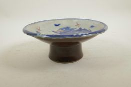 A Chinese blue and white porcelain stem bowl decorated with a dragon chasing the flaming pearl,