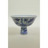 A Chinese Ming style blue and white porcelain stem cup decorated with carp in a lotus pond, 6