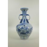 A Chinese Yuan style blue and white porcelain two handled vase decorated with waterfowl and