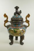 A Chinese cloisonne two handled censer and cover on tripod supports, with a kylin surmount, dragon