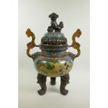 A Chinese cloisonne two handled censer and cover on tripod supports, with a kylin surmount, dragon