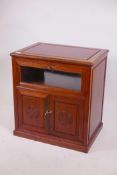 A Chinese hardwood media cabinet, with glazed fall front over two cupboards, 26" x 18" x 28"