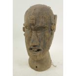 An African carved wood head bust with nail decoration, 10½" high