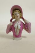 A ceramic pincushion doll, 4"
