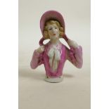 A ceramic pincushion doll, 4"