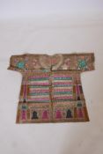 An Islamic linen robe with all over calligraphic decoration, 34" long