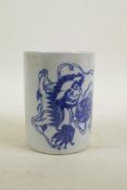 A Chinese blue and white porcelain brush pot decorated with two fo dogs playing, 5½" high, 4"