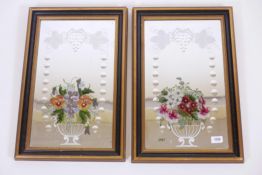 A pair of bevelled glass mirrors, with back painted on cut decoration, late C19th/early C20th,