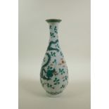 A Chinese late C19th/early C20th slender necked porcelain vase decorated with green enamel dragons
