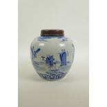 A late C19th/early C20th Chinese blue and white porcelain ginger jar and hardwood cover, decorated