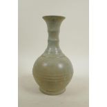 A Chinese celadon glazed pottery ring turned vase in the Song style, 10" high