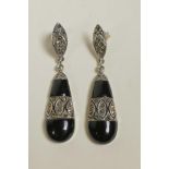 A pair of silver, marcasite and onyx pear shaped drop earrings, 2" drop