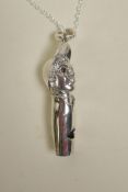 A sterling silver whistle in the form of a boy, 1½" long