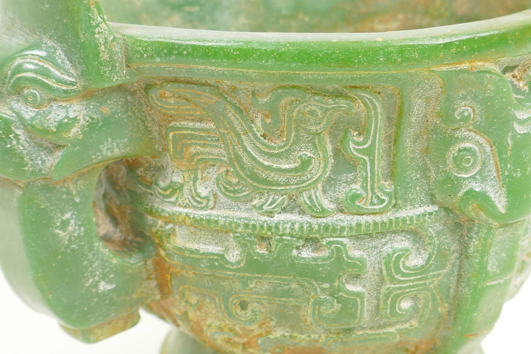 A Chinese carved green hardstone censer with two mask handles on pedestal base carved with birds and - Image 3 of 5