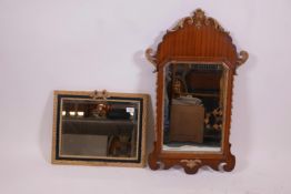 A Georgian style mahogany veneered and parcel gilt wall mirror, 19" x 32", and a parcel gilt and