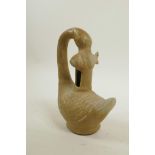 A Chinese celadon glazed pottery censer/vessel in the form of a goose and carp, 7" high