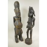 Two African carved wood ritual figures, largest 22" high