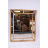 A giltwood sectional wall mirror, 34" x 42", A/F minor damage, fitted with antiqued glass