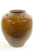 An Oriental treacle glazed storage jar, A/F, 14" high