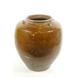 An Oriental treacle glazed storage jar, A/F, 14" high