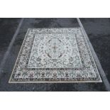 A cream ground square rug with an Oriental multicolour floral design, 77½" x 77"