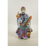 A Chinese polychrome porcelain figure of an emperor, 14" high