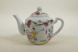 A Chinese Republic style polychrome porcelain teapot decorated with children playing beneath a