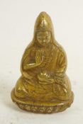 A gilt bronze figure of Buddha, 2½" high
