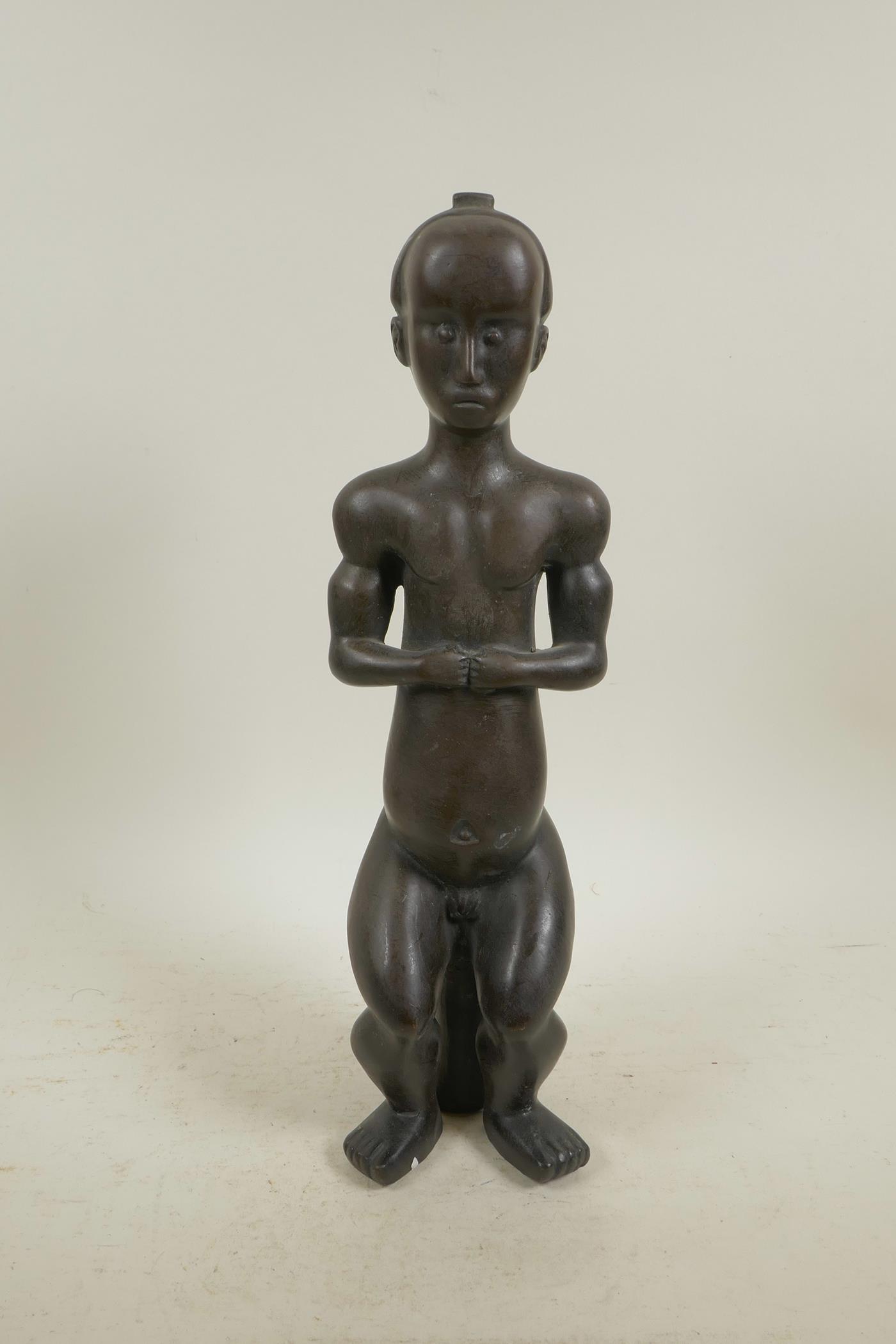 A naive bronze nude figure, 14½" high