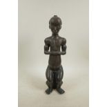 A naive bronze nude figure, 14½" high