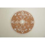 A Chinese hardstone pi disc with archaic style decoration, 8" diameter