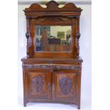 A Victorian walnut mirror backed sideboard with shaped top and bevelled glass over two moulded front