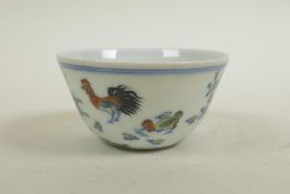 A Chinese doucai porcelain tea bowl with chicken decoration, seal mark to base, 3" diameter