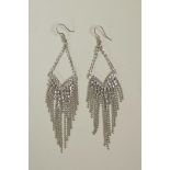 A pair of silver and cubic zirconium drop earrings, 4" drop
