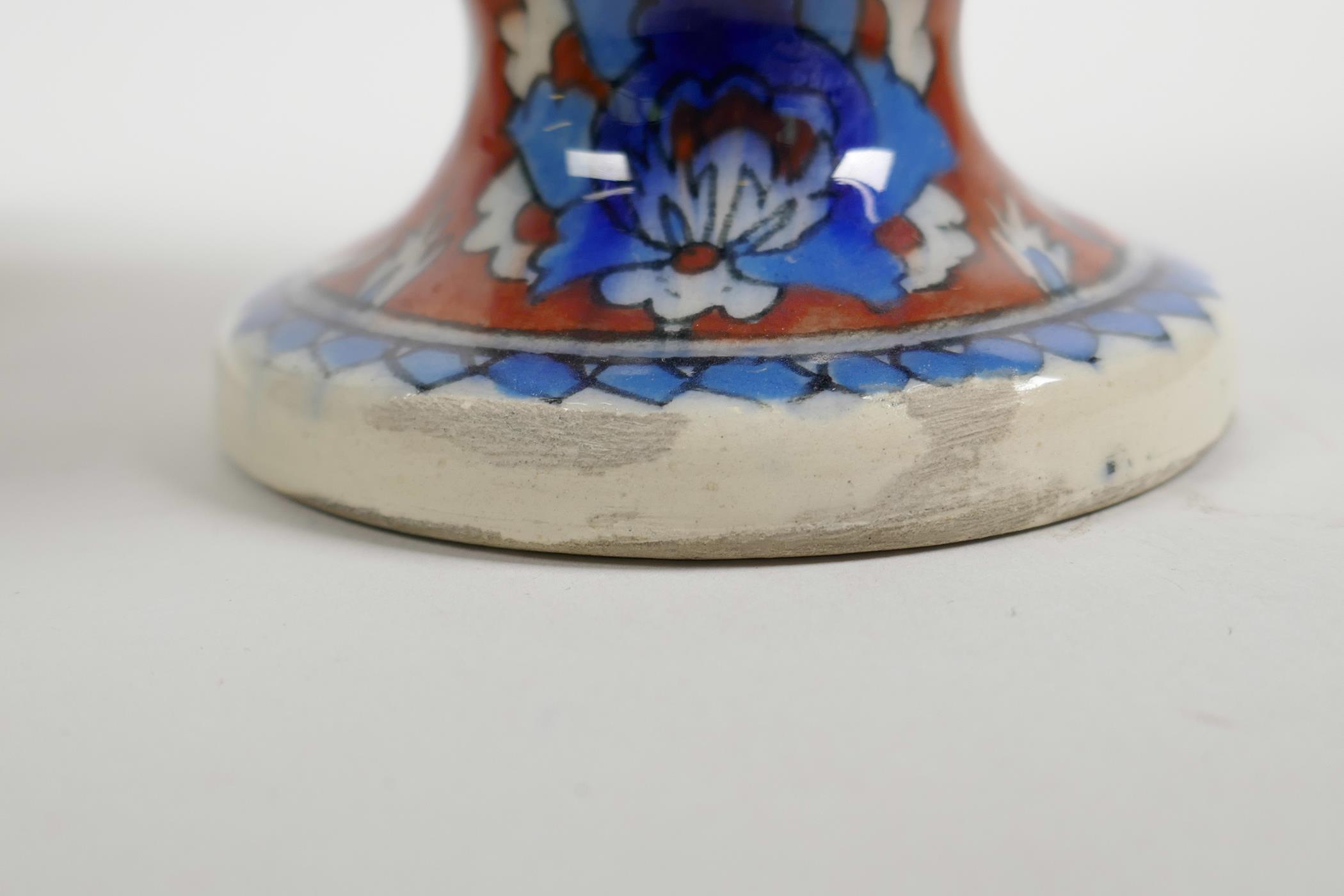 An early C20th Turkish Kutahya pottery ewer with traditional floral decoration, repair to handle, - Image 6 of 7