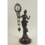 A bronze mystery clock cast in the form of an Art Nouveau lady, 11½" high