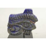 An Egyptian carved lapis eye, 2" wide