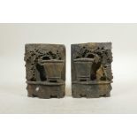 A pair of Chinese carved soapstone bookends, with floral decoration, 4" x 5½"